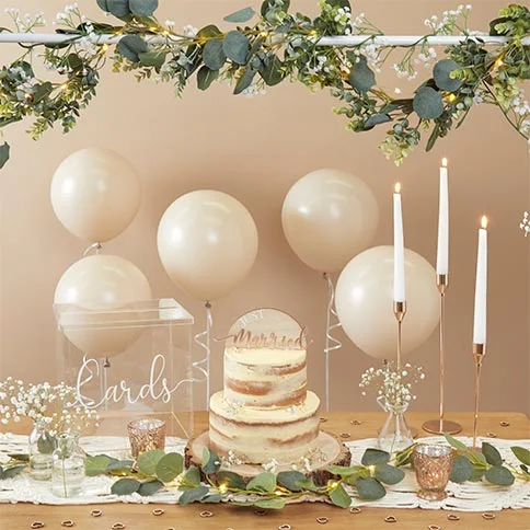Neutral birthday table styling with cake and candles