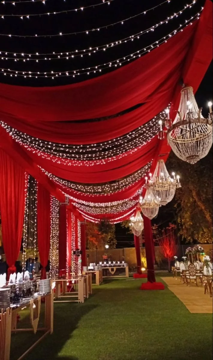 Red draped entrance with hanging lights